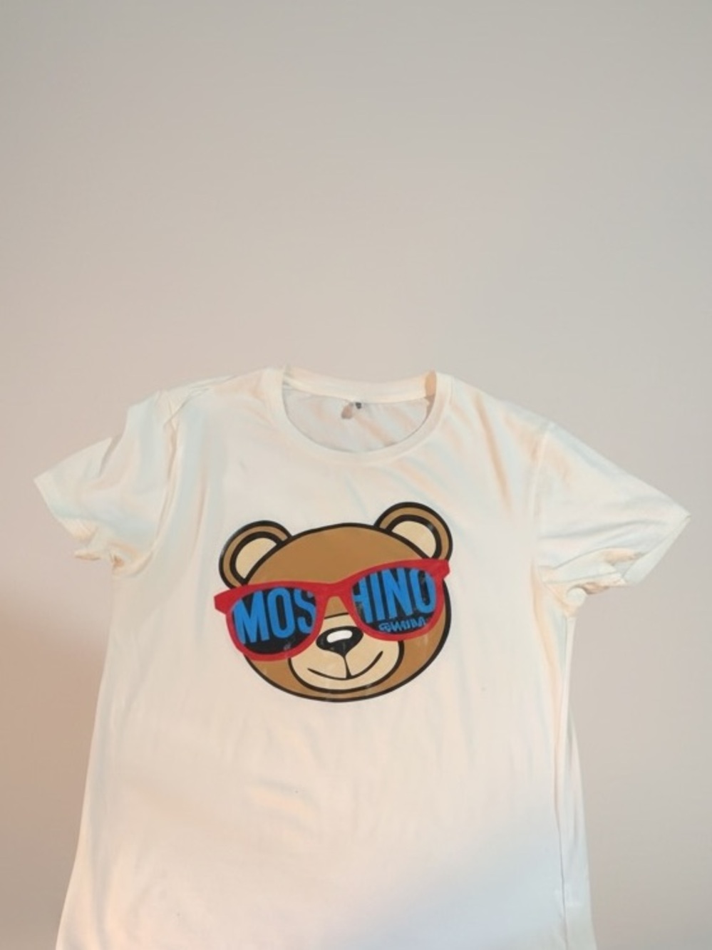Moschino White Tee with Bear Graphic and Blue-Red Sunglasses